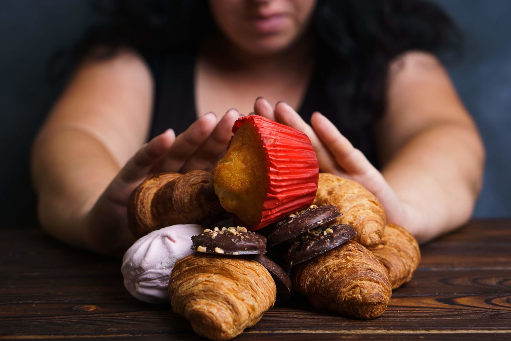 Young woman refuse eating junk food