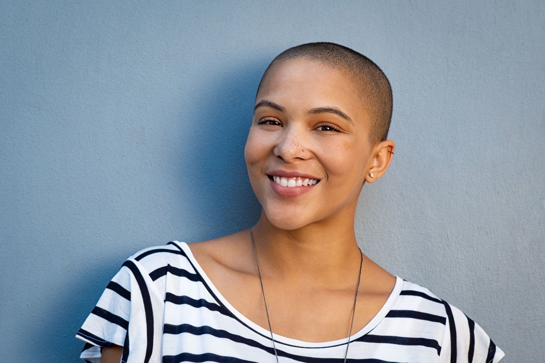 Happy stylish bald woman