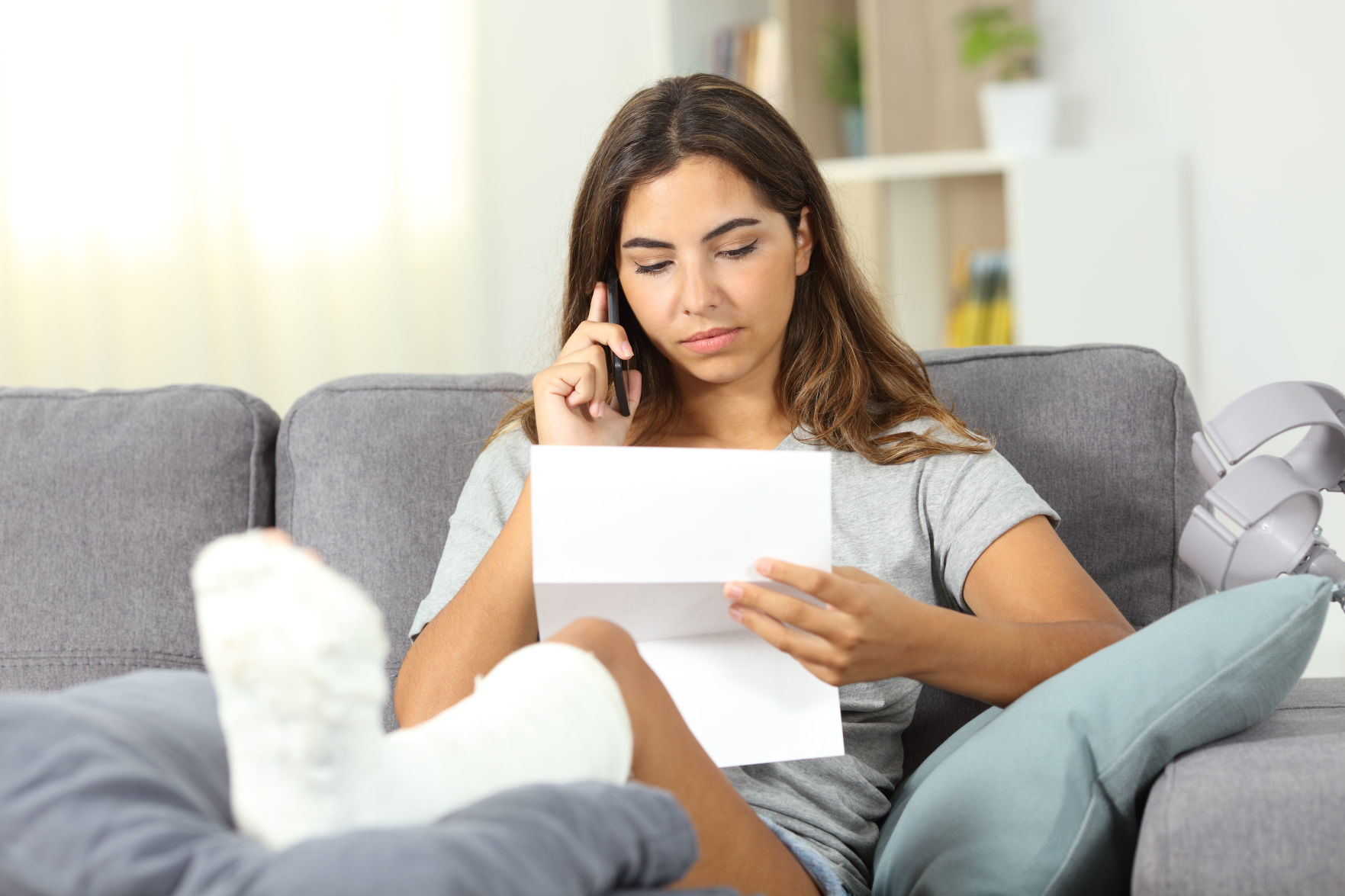 Disabled woman calling on phone about a letter